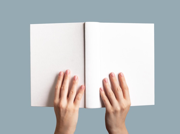 Hands holding open book mock up blank empty hard cover hardcover mockup