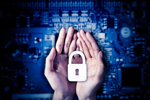 Hands holding a padlock symbol with circuit board