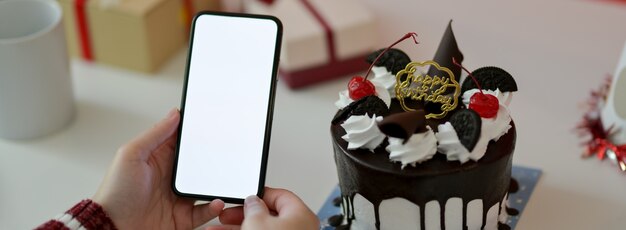 Hands holding a phone with blank screen