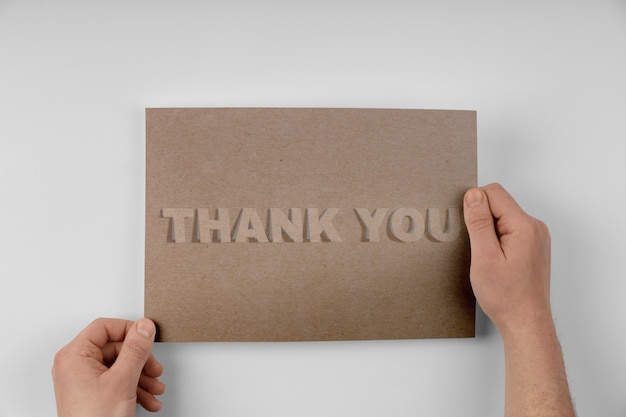 Hands holding professional thank you note