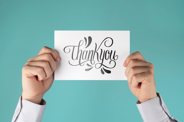 Hands holding professional thank you note