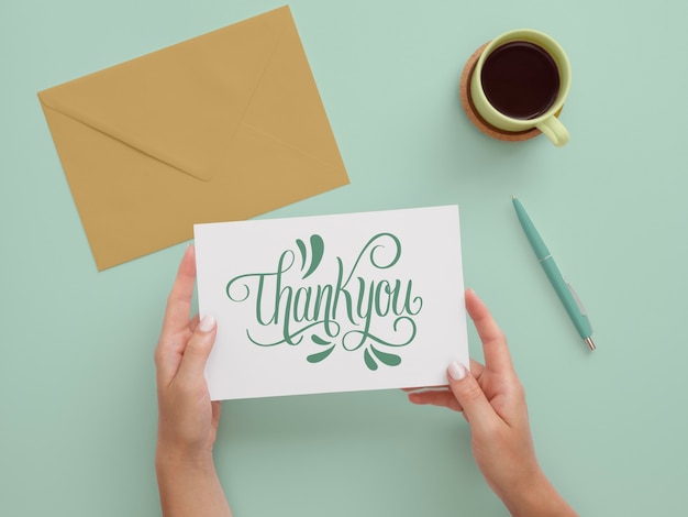 Hands holding professional thank you note