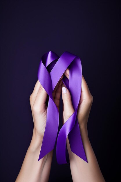 Hands holding purple ribbons world cancer day concept