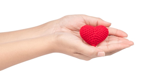 hands holding red crocheted heart isolated on white background