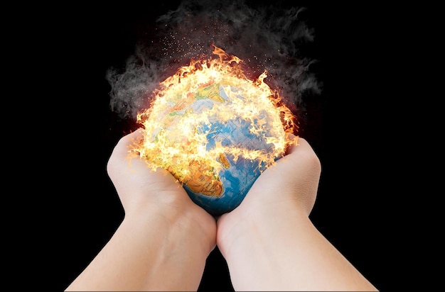 Hands holding a small globe model in fire
