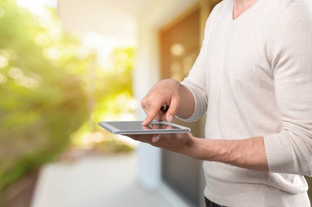 Hands holding a tablet