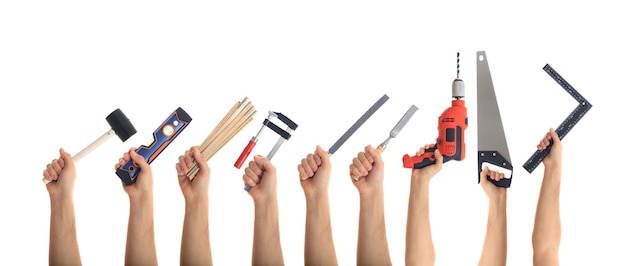 Photo hands holding tools on white background