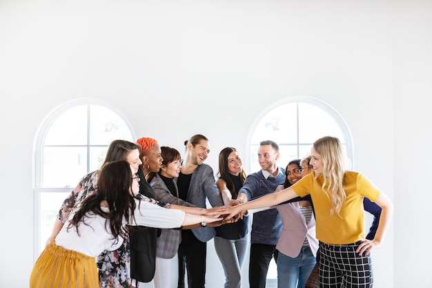 Hands joined in a meeting room