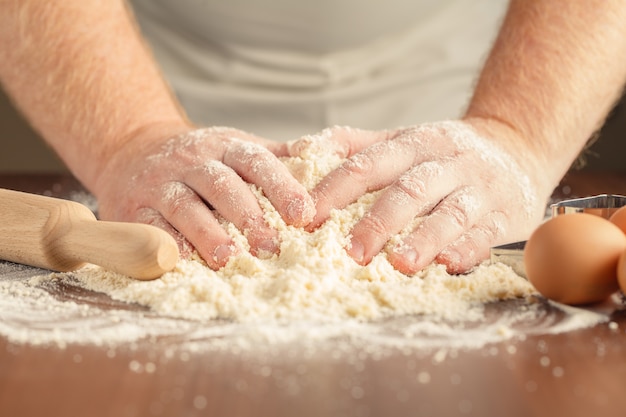 Hands kneading a dough