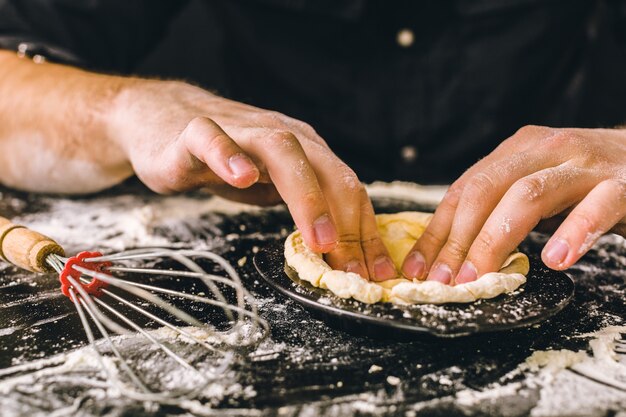 Hands kneading a dough