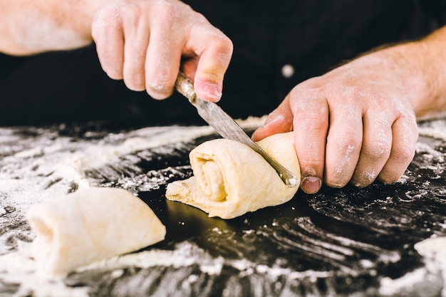 Hands kneading a dough