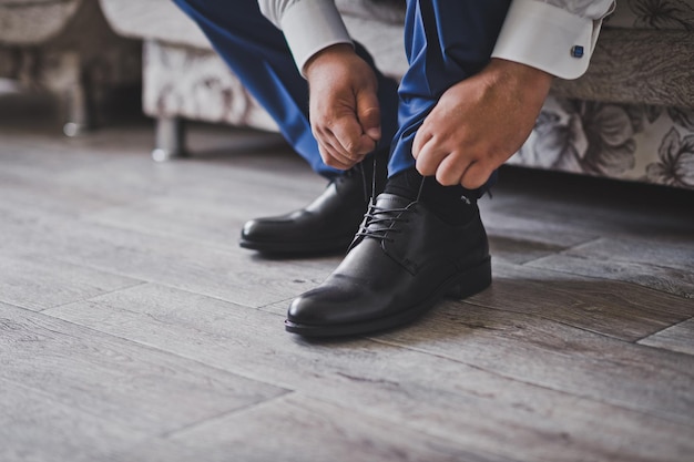 Hands lacing shoes before going out 2360