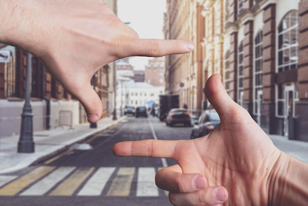 The hands making a square frame, camera sign gesture