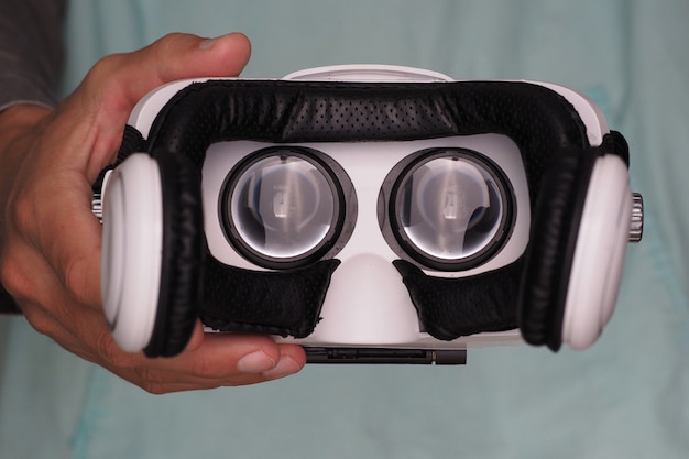 Hands Of Man Holding Virtual Reality Goggles.