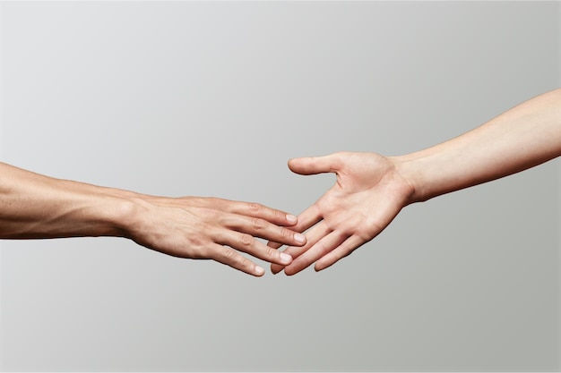 Photo hands of man and woman reaching