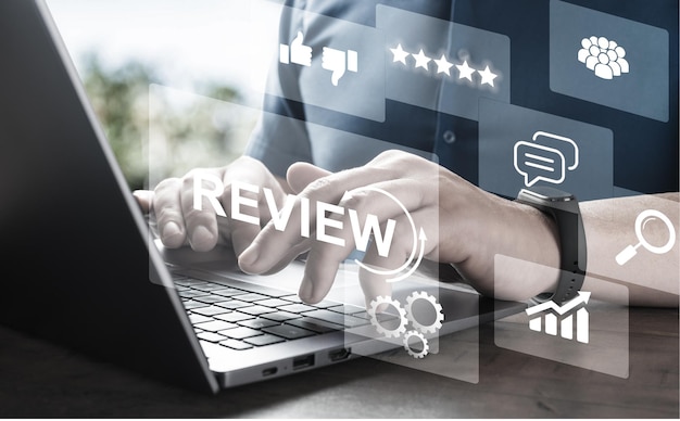 Hands of man write review on product and evaluate product purchased online rating to seller Consumer reviews concepts people review comments on laptop customer product rating review