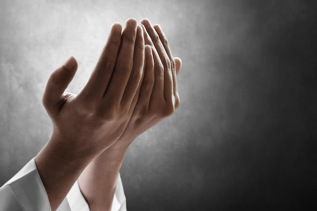 Hands of muslim man praying