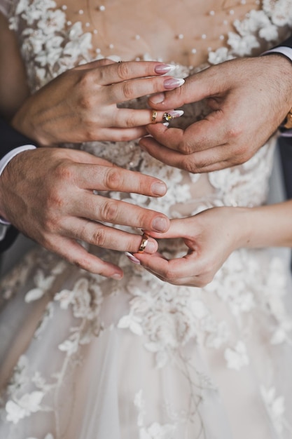 Hands of newlyweds with rings to each other 1962