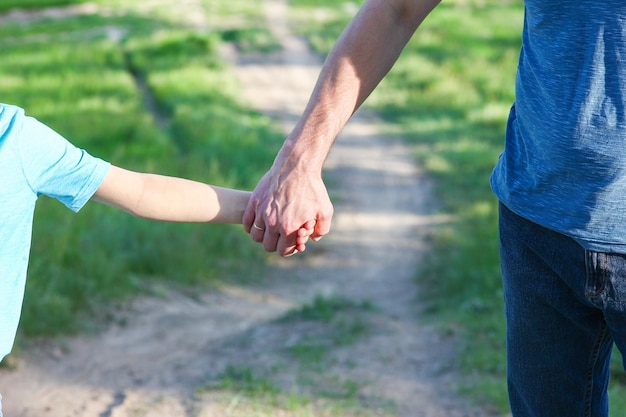 Hands of parent and child