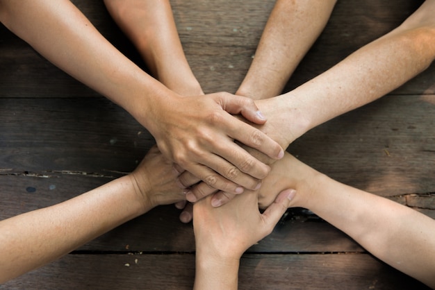 Photo hands of people joining together, team work concept.