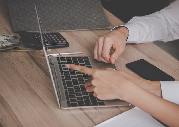 Hands pointing on Laptop for business meeting