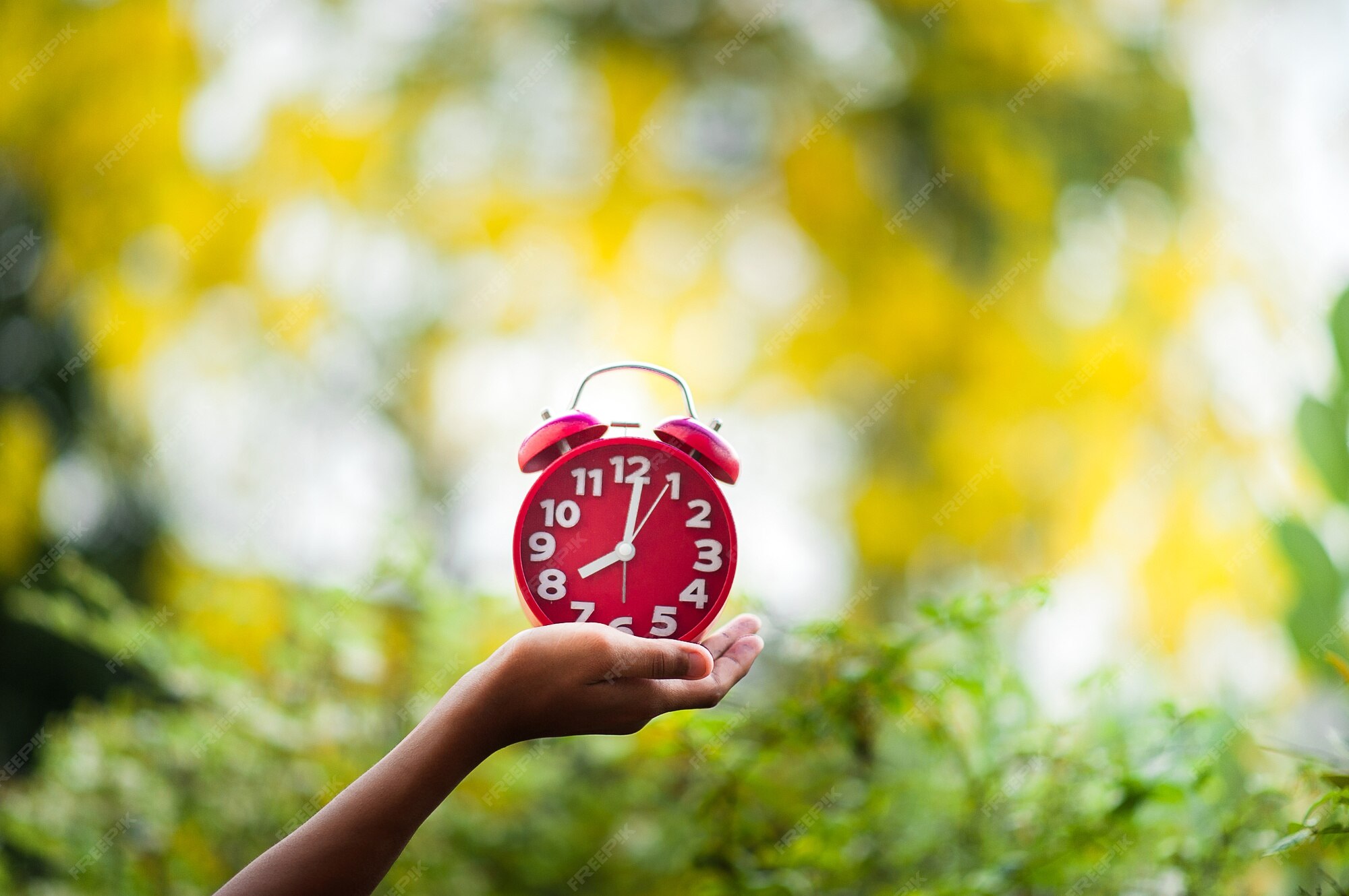 Premium Photo | Hands and red clocks