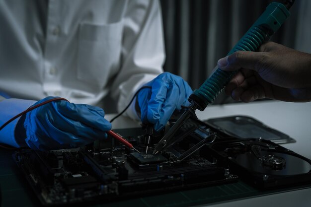 Hands repairing electronic devices Electronic technician