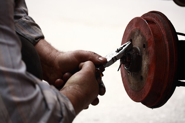 Hands of repairman repairing