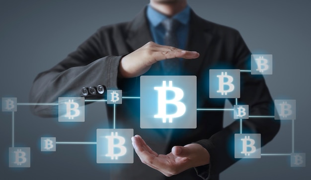 Photo hands showing bitcoin icon as virtual money on digital