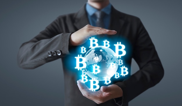 Hands showing bitcoin icon as virtual money on digital