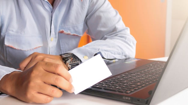 Hands showing business cards 