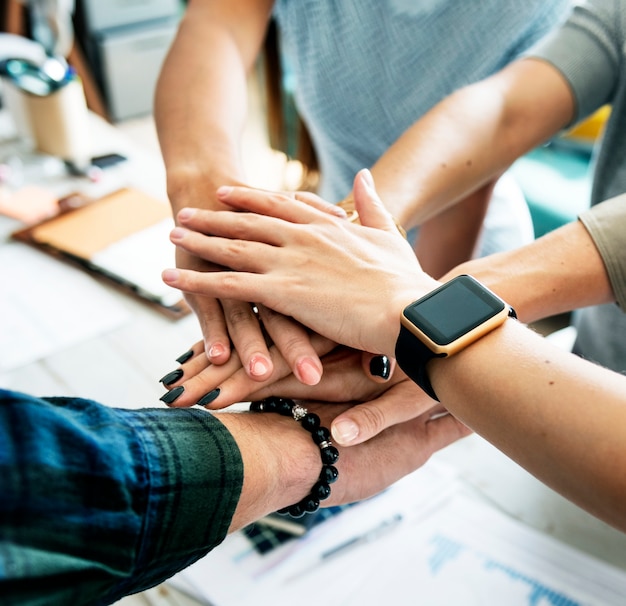 Hands stacking support each other