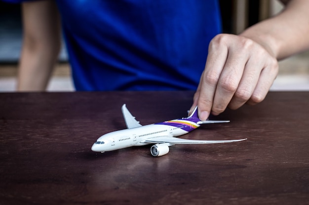 Photo hands support airplane model