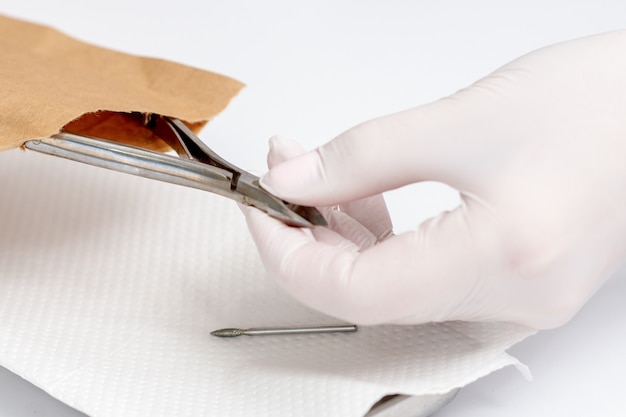 Hands taking out manicure tools.