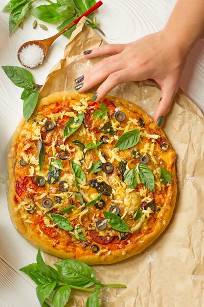 Photo hands taking slices of pizza. hand holding slice pizza.