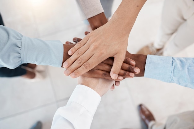 Premium Photo | Hands teamwork and motivation with business people standing in a huddle or circle together from above office meeting and solidarity with a man and woman employee group joined in Premium Photo | Hands teamwork and motivation with business people standing in a huddle or circle together from above office meeting and solidarity with a man and woman employee group joined in