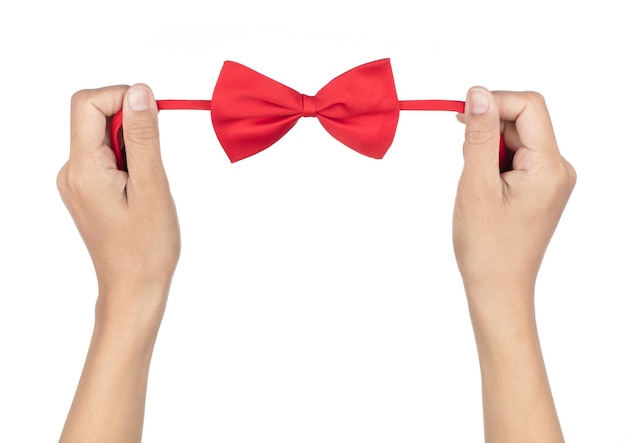 Hands tying red bow tie isolated on a white background