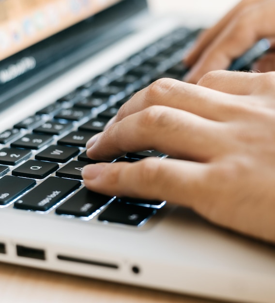 Hands typing on a keyboard