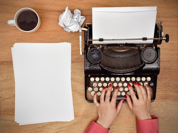 Hands typing on a Vintage typewriter