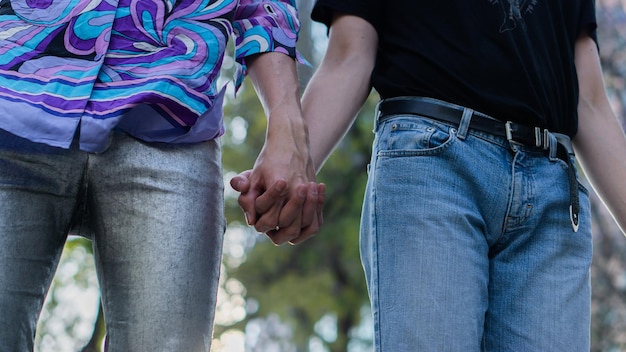 Hands of unrecognizable persons subject to both belong to two men.