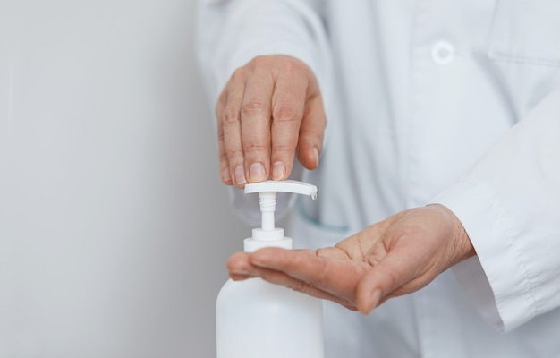 Hands using alcohol wash gel for cleaning sanitize