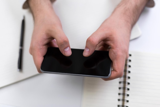 Hands using smartphone closeup