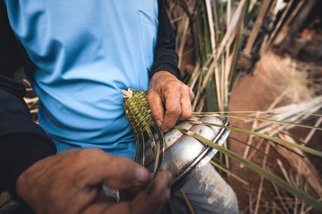 Hands weaving bamboo baskets at home,make a basket