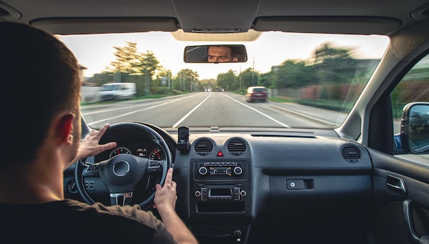 Photo hands on the wheel when driving at high speed from inside the car