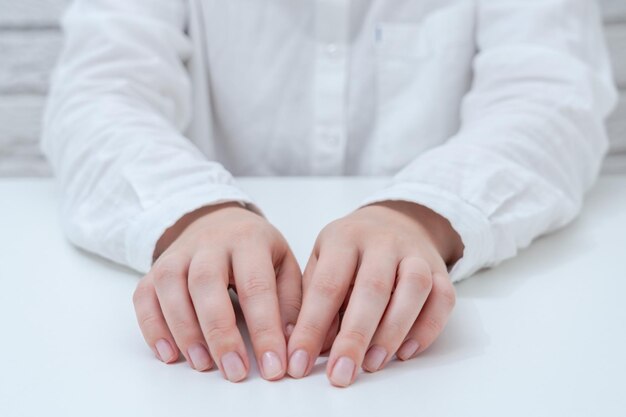 Hands in white shirt on white table Business conceptxA