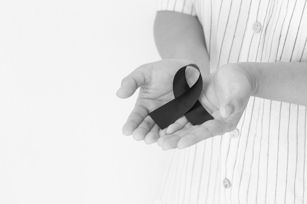 Hands with black ribbon