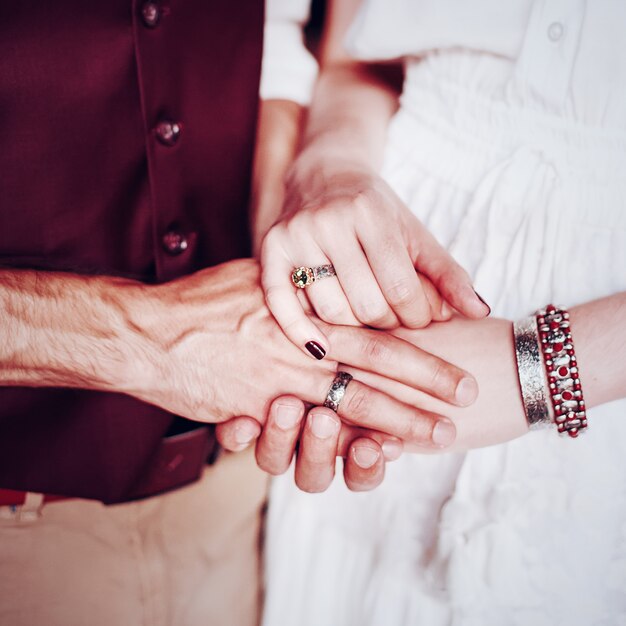 Hands with boho chic accessories close-up