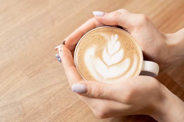 Hands with coffee