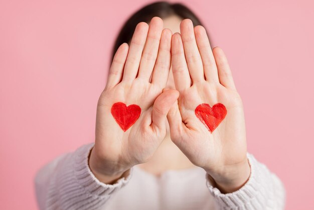 hands with drawn hearts valentines day concept