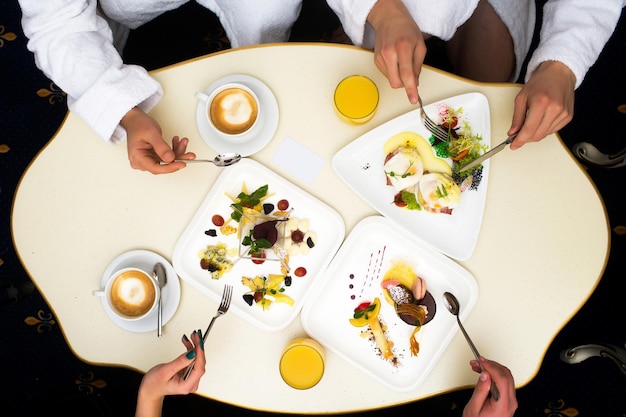 Hands with food and drinks